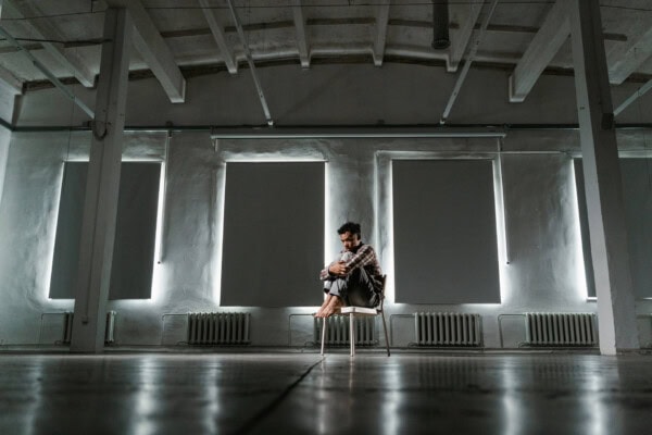 kid sitting on a chair alone