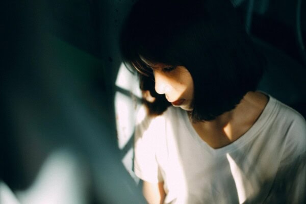 man sitting looking at the sunset